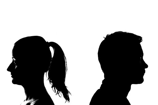 Stencil image of a man and a woman facing the opposite direction