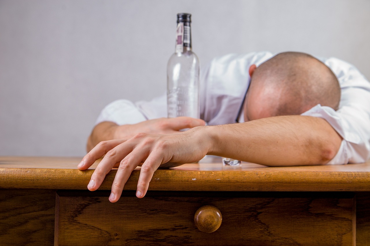 drunk man sleeping on the table